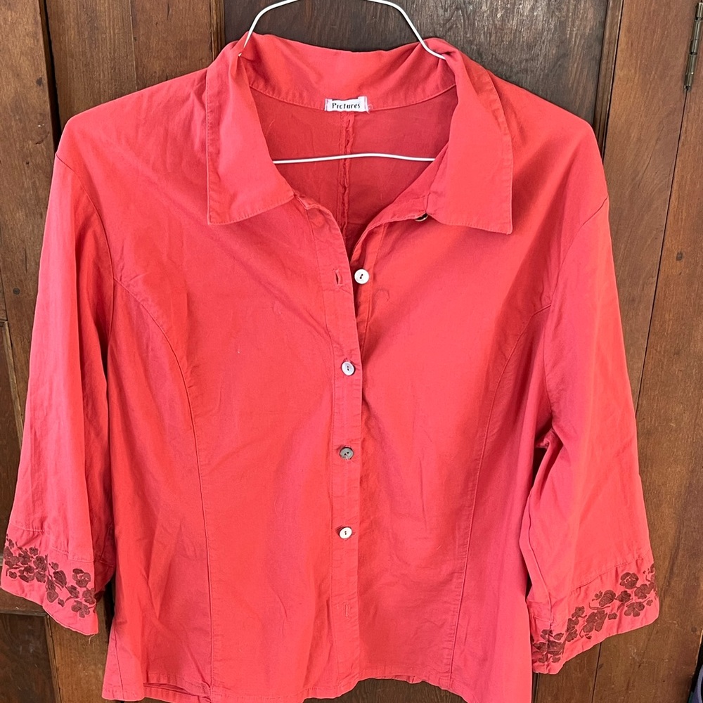Embroidered orange top with brown embroidered florals.